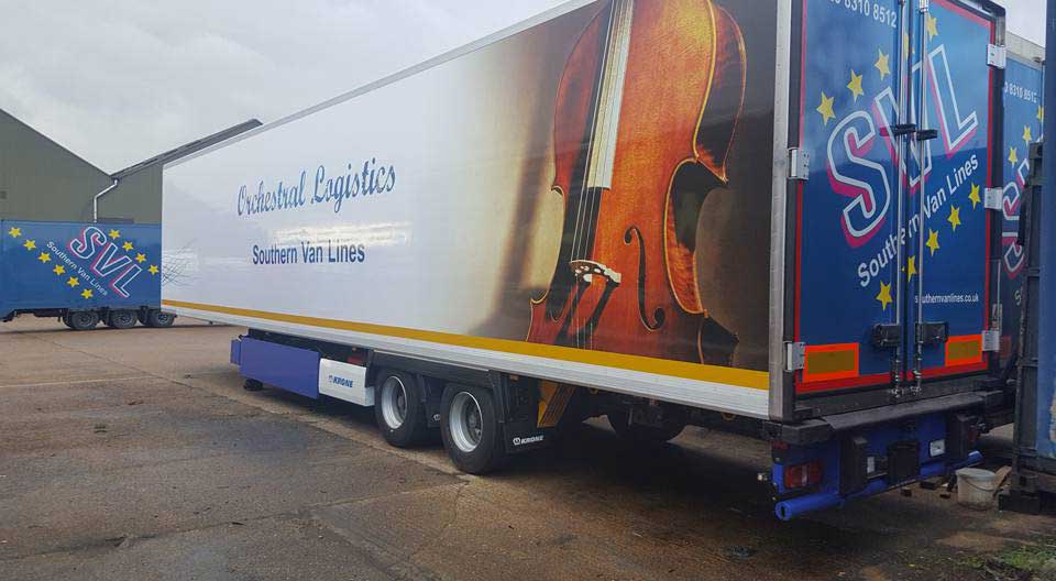 Temperature controlled trailer for transporting orchestra musical instruments.